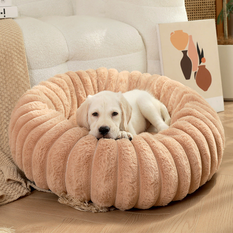 Round plush pet bed in a living room
